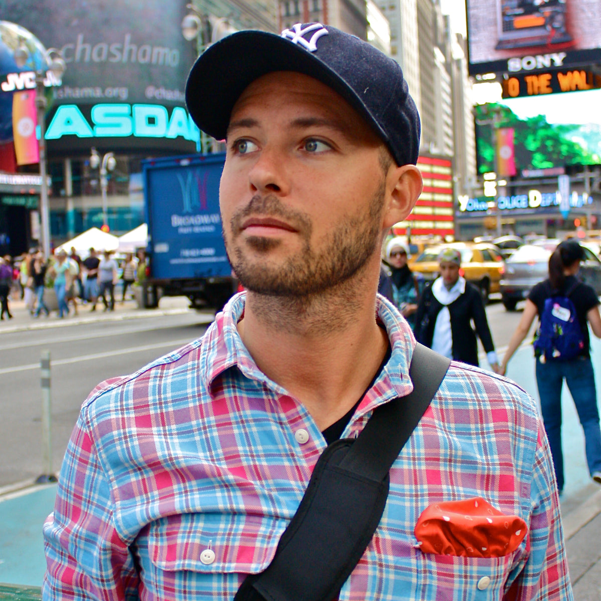 FatCloth Earl Red pocket square paired with a baseball cap in a casual Wall Street setting
