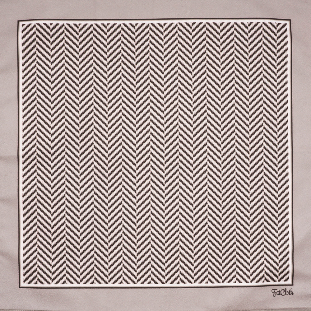 Graphic herringbone pattern of FatCloth Gregory Bone pocket square is created out of small droplets