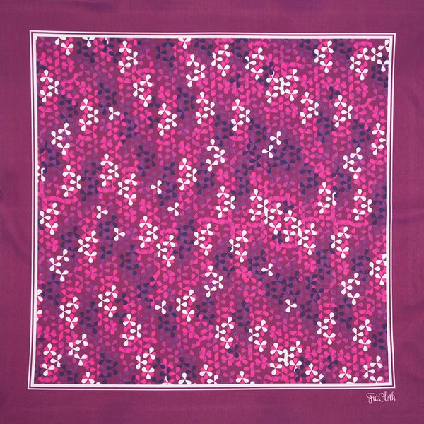 Graphic floral design of FatCloth Manuel Purple pocket square summons the bees to your pocket 