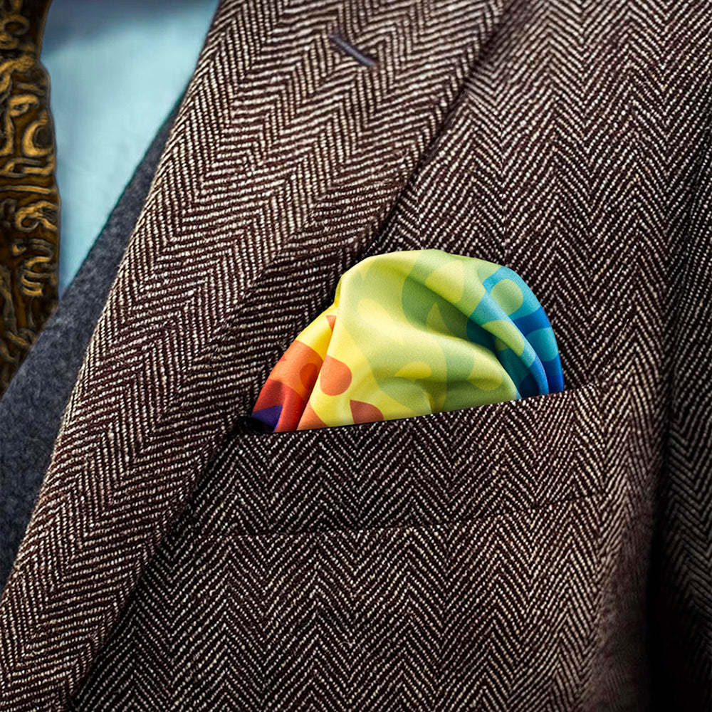 Rainbow patterned FatCloth Nelson puff fold in a brown herringbone tweed pocket
