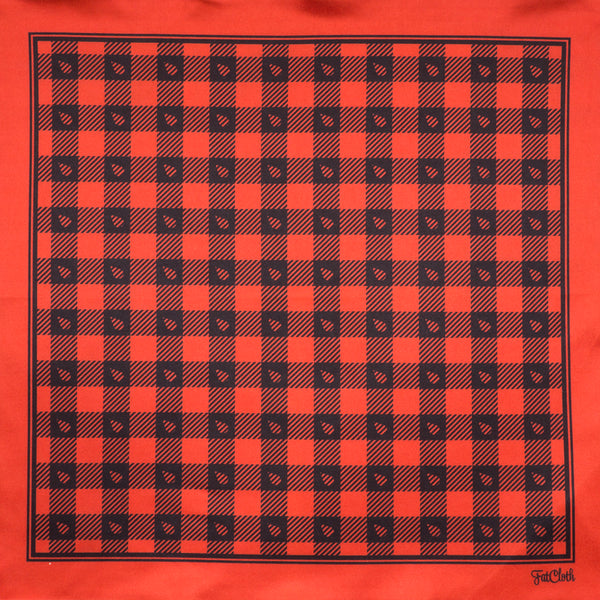 Red and black lumberjack pattern of Stig features FatCloth’s signature drop symbol in classic crosshatch background