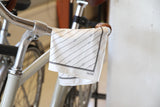 The versatile FatCloth Bernie white multipurpose square is also perfect for wiping that damp bike seat if the situation should require it