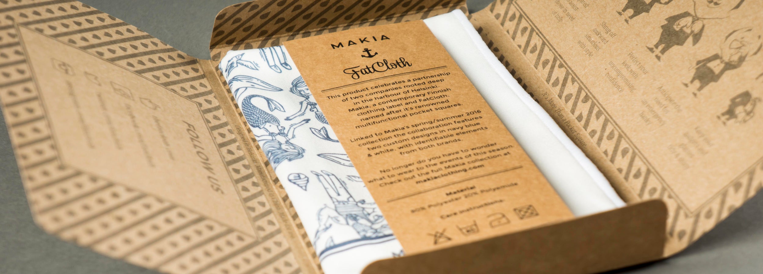 Detailed closeup of open FatCloth product box on gray background