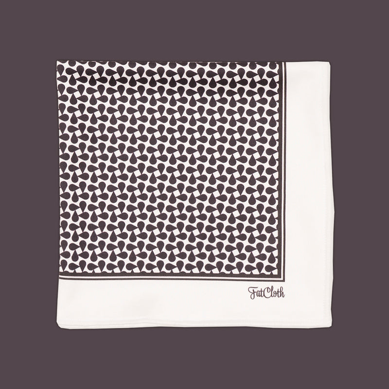 Timeless FatCloth pocket square Aziz in repetitive black and white kufiya pattern