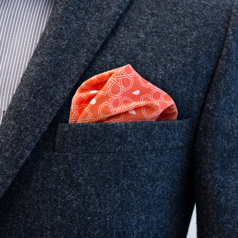 Versatile FatCloth Butrus Orange pocket square looks especially good in blue, gray and brown pockets