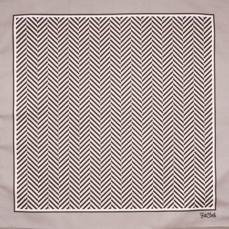 Graphic herringbone pattern of FatCloth Gregory Bone pocket square is created out of small droplets