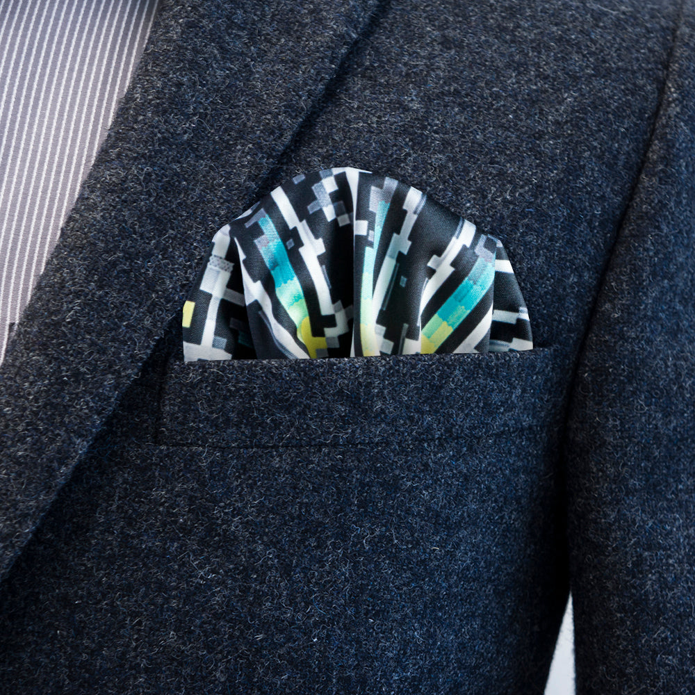 The early computer graphic ANSI style design of Herrasmieshakkerit x FatCloth pocket square works great as a puff fold
