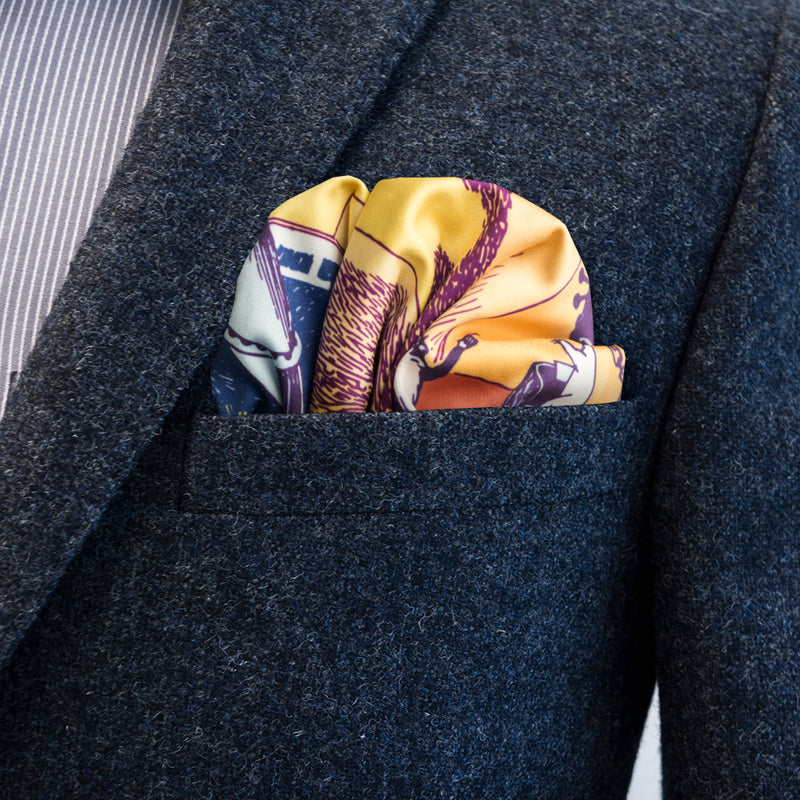 Moomin Observatory by FatCloth pocket square’s violet, orange and flame colour combination works as a great contrast to plain backgrounds of single tone suits