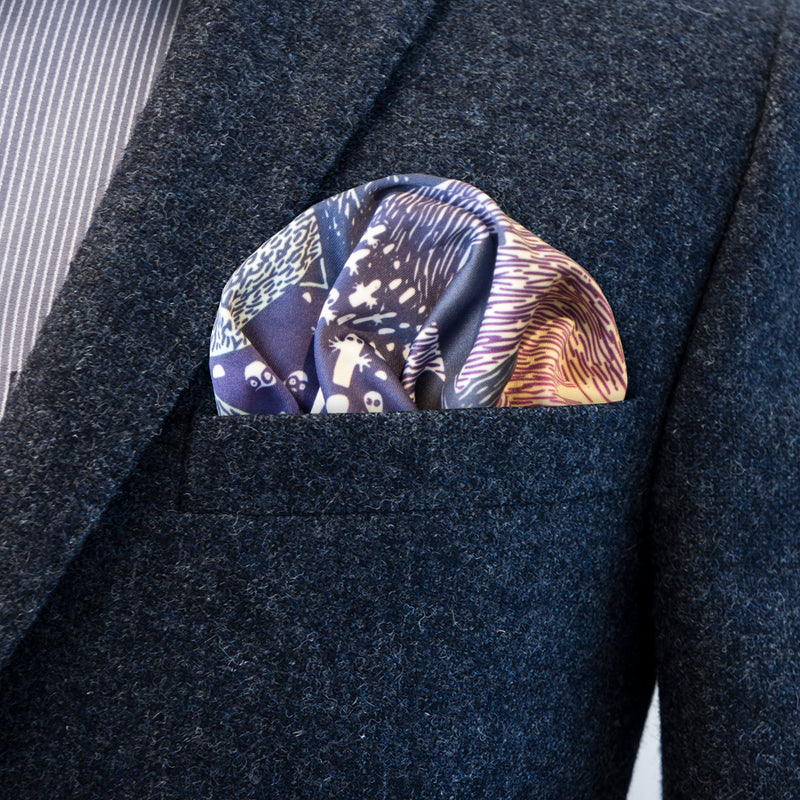 Moomin Shock by FatCloth pocket square’s purple and white colour combination complements blue tones especially well