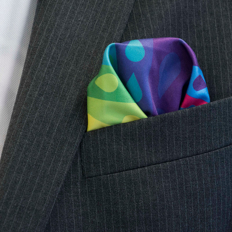 FatCloth Nelson rainbow coloured pocket square is at home in formal suits' pockets as well