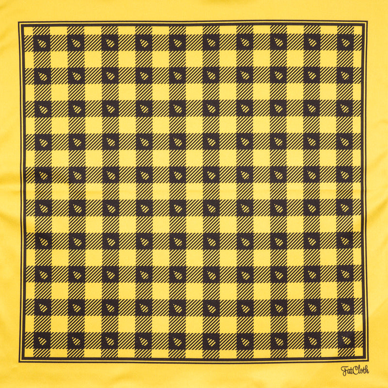 Yellow and black lumberjack pattern of Stig features FatCloth’s signature drop symbol in traditional chequered background