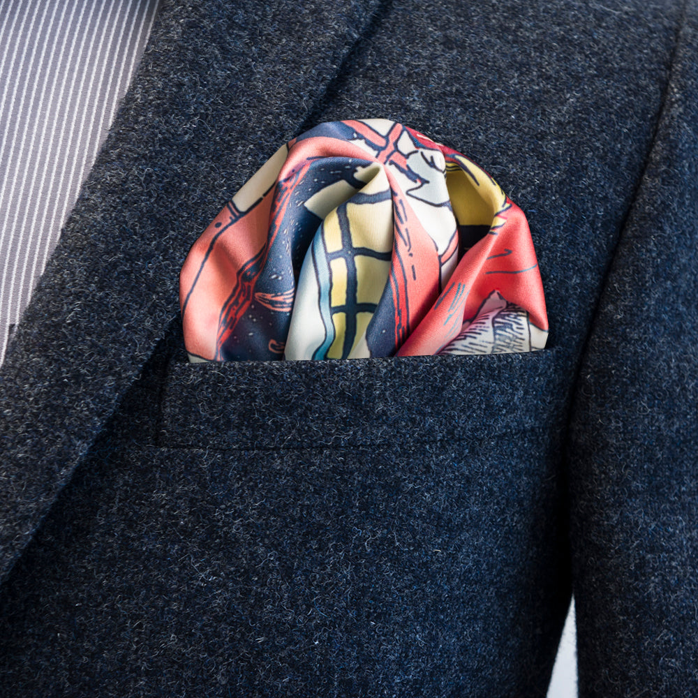 Moomin Spring by FatCloth pocket square’s light yellow, red and blue colour complements well lighter outfits of the warm season