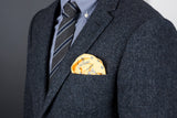 Classic but casual combination of a FatCloth 22821 yellow pocket square in a dark blazer pocket